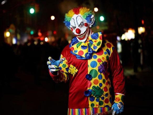 A terrifying clown walks in a Halloween parade in New York
